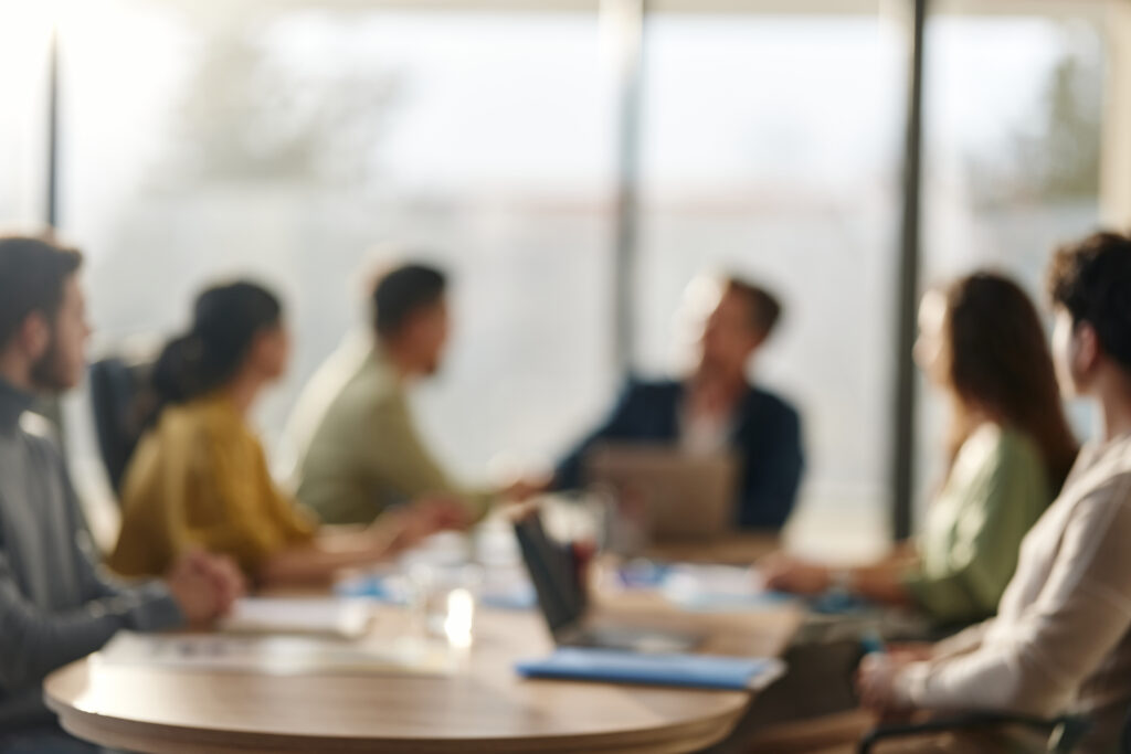 Defocused business meeting background.